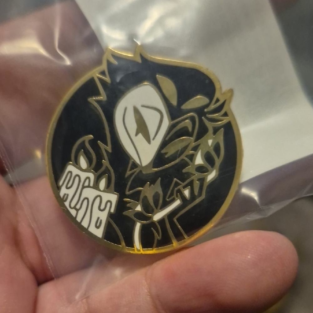 Gold and Black Enamel Pin with Candle Design